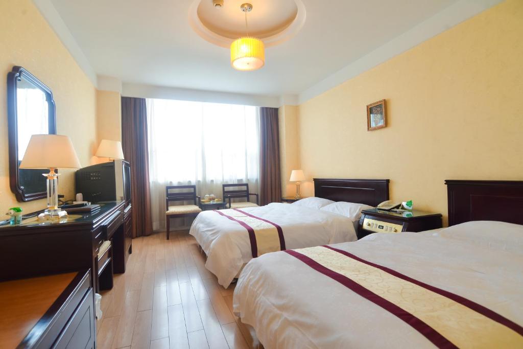 Двухместный (Двухместный номер с 2 отдельными кроватями) отеля Qinhuangdao Yang Cheng Hotel, Циньхуандао