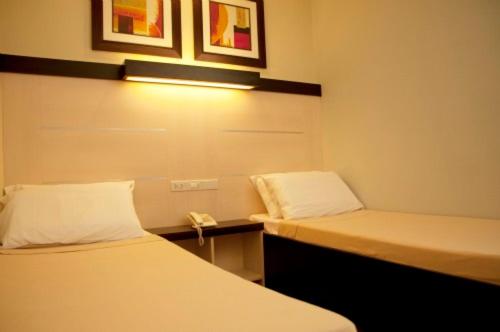 Двухместный (Стандартный двухместный номер с 2 отдельными кроватями) отеля Sugbutel Family Hotel, Себу