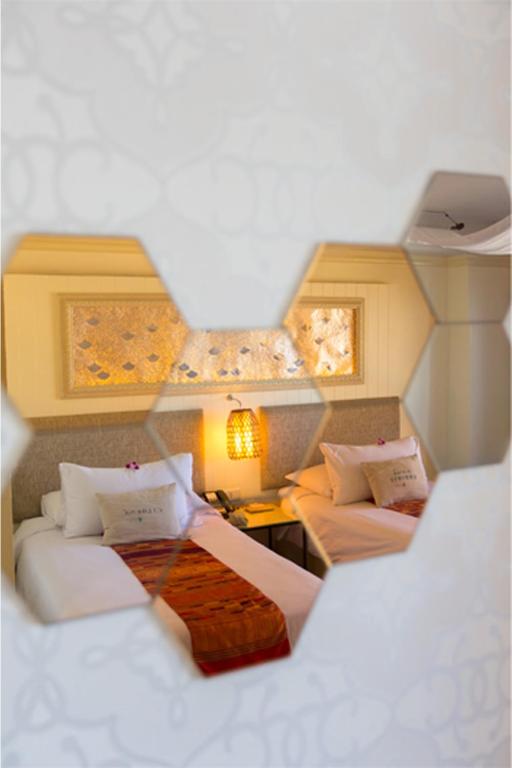 Двухместный (Улучшенный двухместный номер с 2 отдельными кроватями) отеля Ploy Palace Hotel, Мукдахан