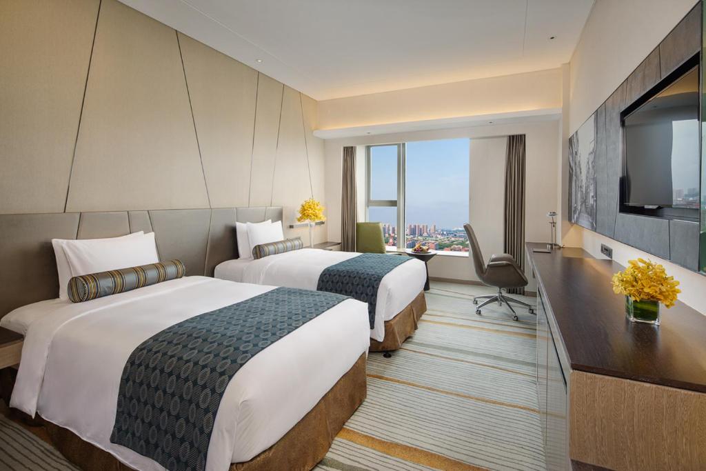 Двухместный (Улучшенный двухместный номер с 1 кроватью или 2 отдельными кроватями) отеля Radisson Blu Shanghai Pudong Jinqiao, Шанхай