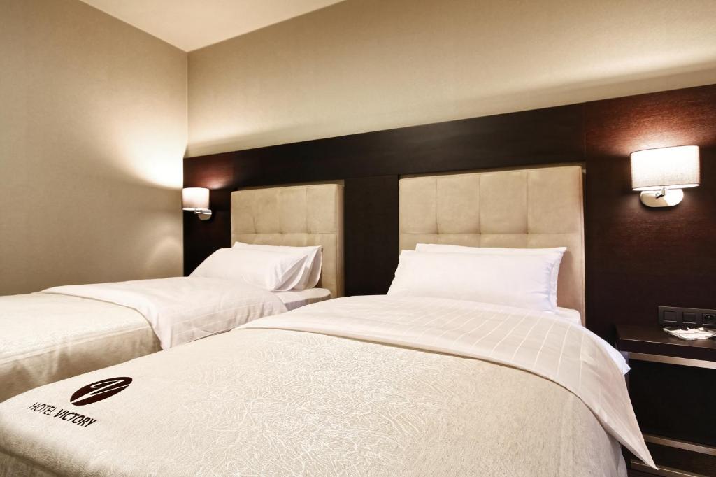Двухместный (Улучшенный двухместный номер с 2 отдельными кроватями) отеля Hotel Victory, Брно