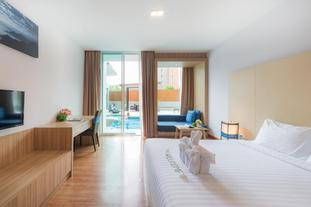 Двухместный (Двухместный номер Делюкс с 1 кроватью и доступом к бассейну) отеля Grand Vista Chiangrai, Чианграй