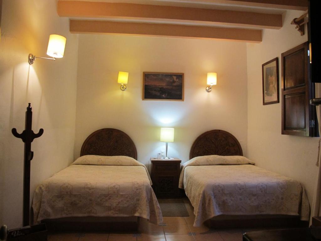 Двухместный (Двухместный номер с 2 двуспальными кроватями) отеля Posada del Virrey, Текискиаппан
