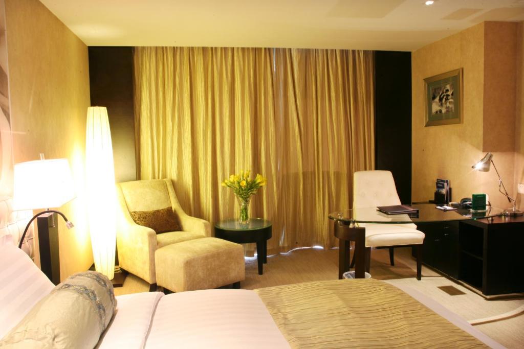 Двухместный (Представительский улучшенный двухместный номер с 1 кроватью) отеля China National Convention Center Grand Hotel, Пекин