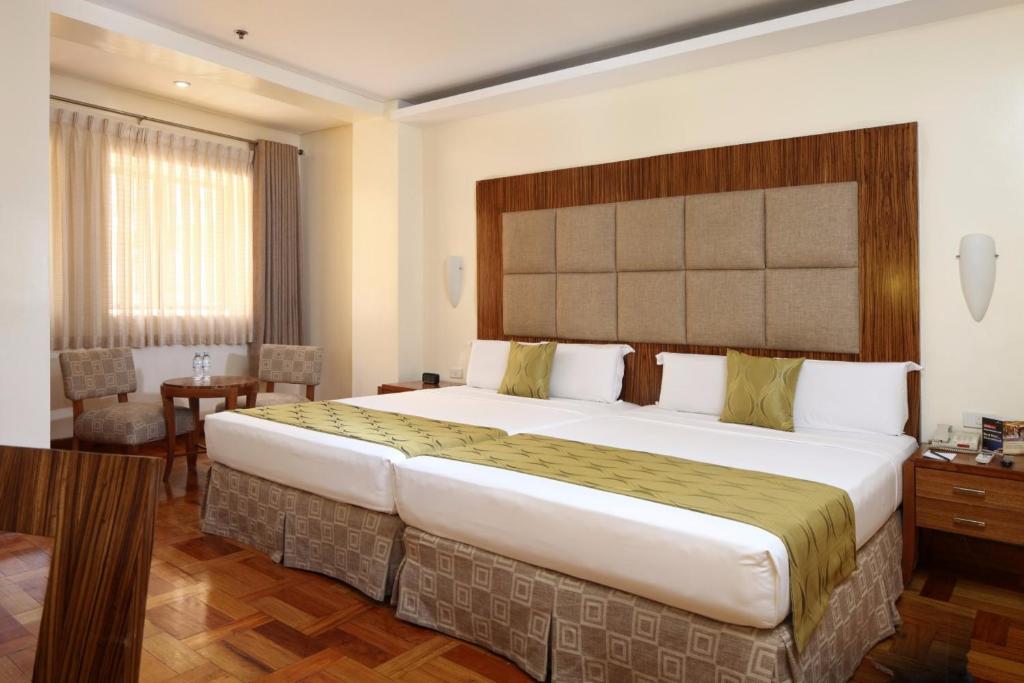 Двухместный (Двухместный номер Делюкс с 2 отдельными кроватями) отеля City Garden Suites, Манила