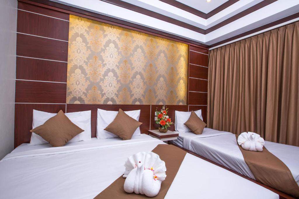 Трехместный (Трехместный номер Делюкс) курортного отеля Phi Phi Andaman Beach Resort, Пхи-Пхи
