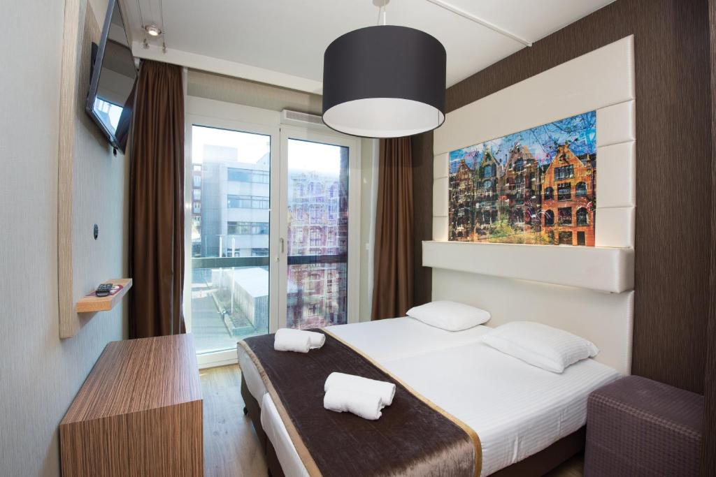 Двухместный (Двухместный номер Делюкс с 1 кроватью и балконом) отеля Hotel Mosaic City Centre, Амстердам