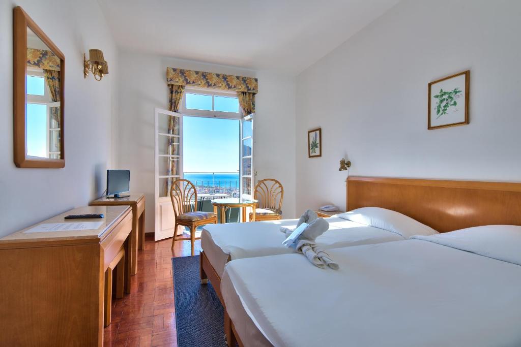 Двухместный (Двухместный номер с 1 кроватью, вид на море) отеля Hotel Monte Carlo, Фуншал
