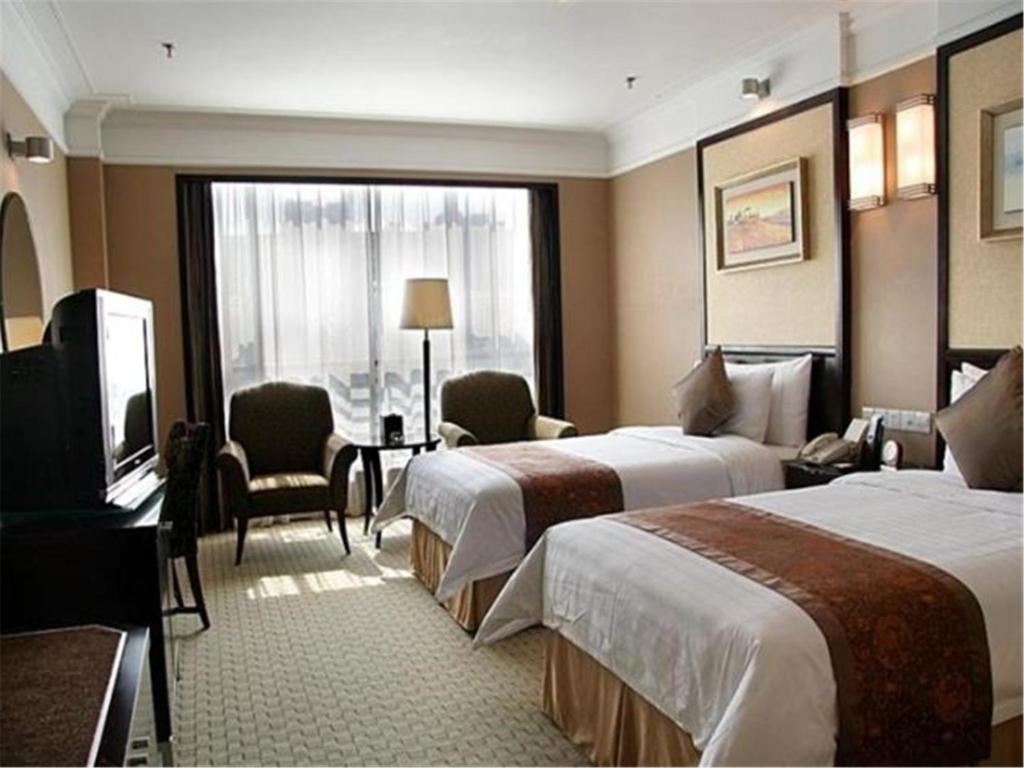 Двухместный (Стандартный двухместный номер с 2 отдельными кроватями) отеля Qingdao Blue Horizon Hotel - Laoshan, Циндао