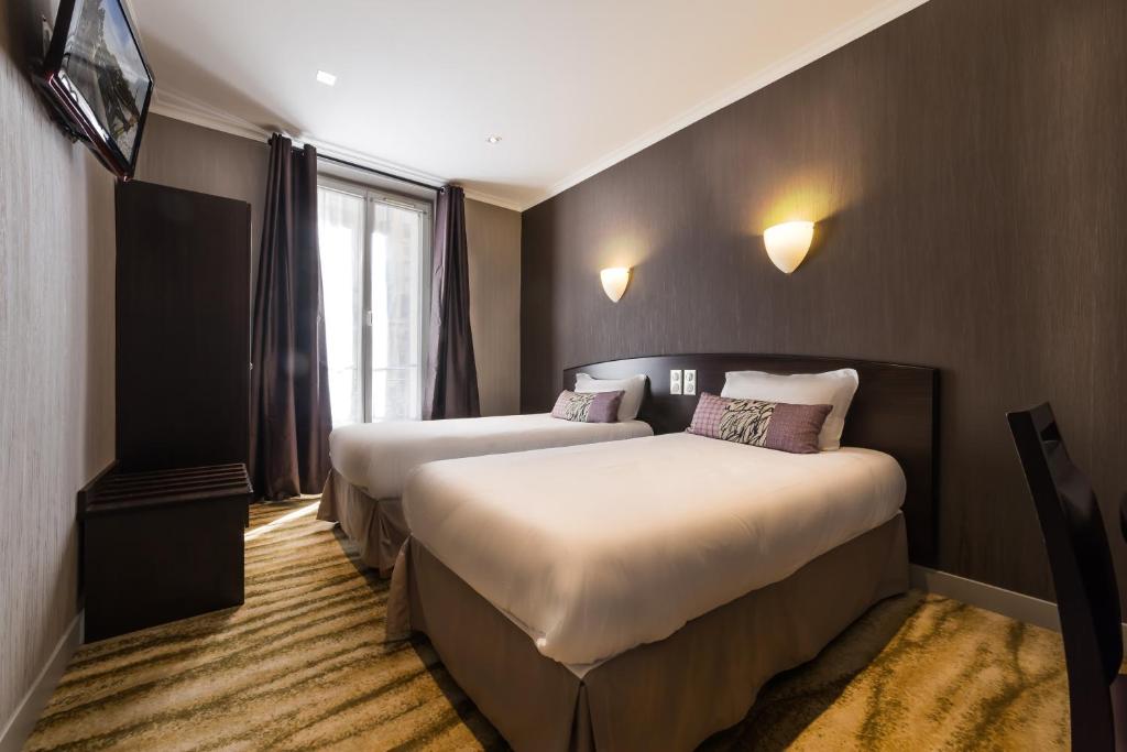 Двухместный (Двухместный номер с 2 отдельными кроватями) отеля Hotel Victor Massé, Париж