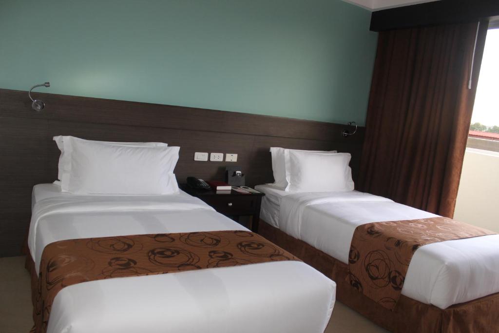 Двухместный (Двухместный номер Делюкс с 2 отдельными кроватями) отеля Kew Hotel - Tagbilaran, Панглао