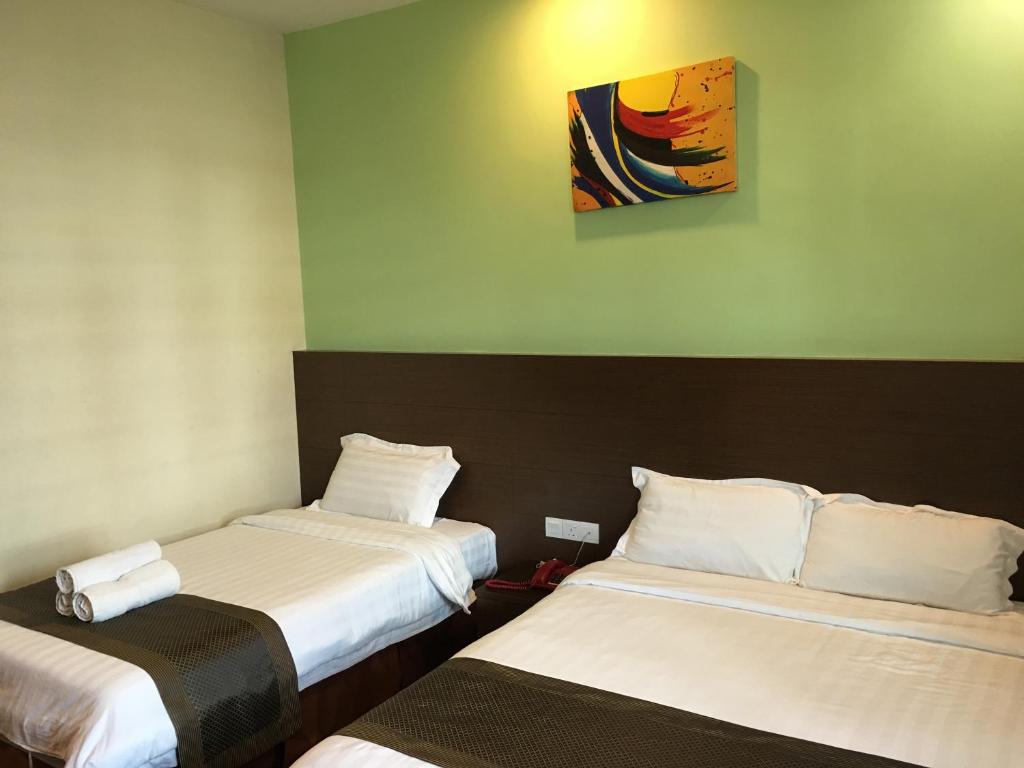 Семейный (Семейный номер Делюкс) отеля Lintas Plaza Hotel, Кота-Кинабалу