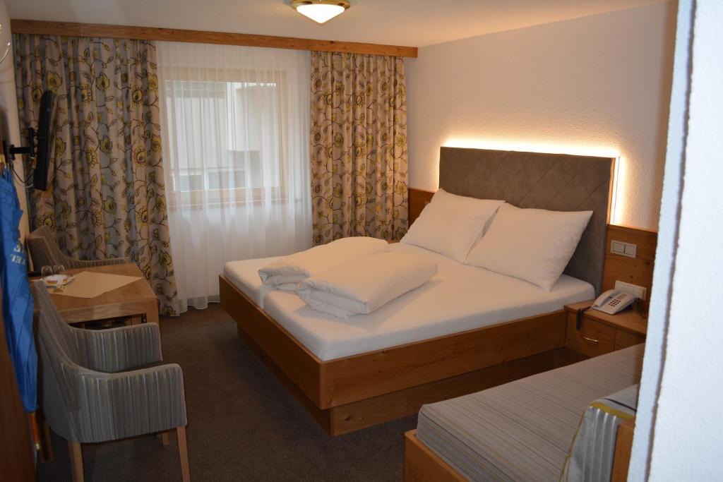 Двухместный (Стандартный двухместный номер с 1 кроватью) отеля Hotel Garni Maria Theresia, Ишгль