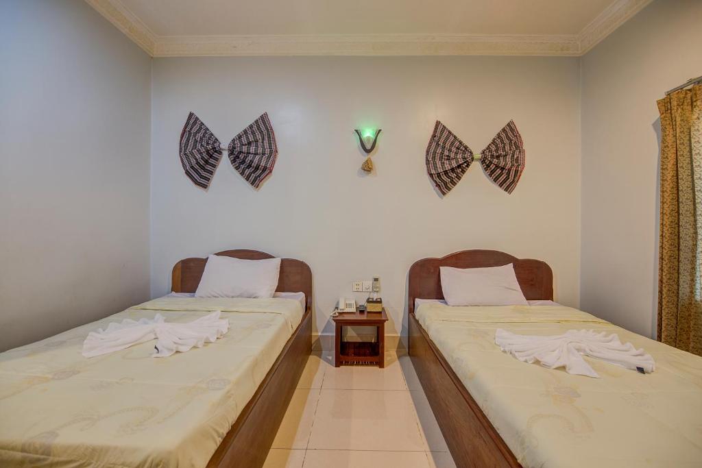 Двухместный (Стандартный двухместный номер с 2 отдельными кроватями) отеля DV Angkor Villa, Сием Рип