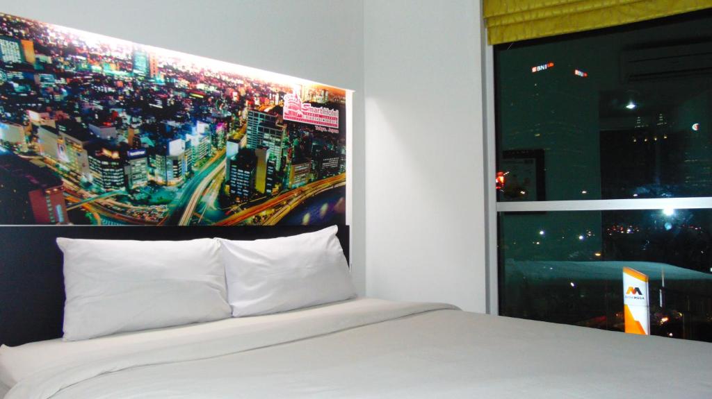 Двухместный (Двухместный номер Делюкс с 1 кроватью) отеля Smart Hotel Thamrin Jakarta, Джакарта