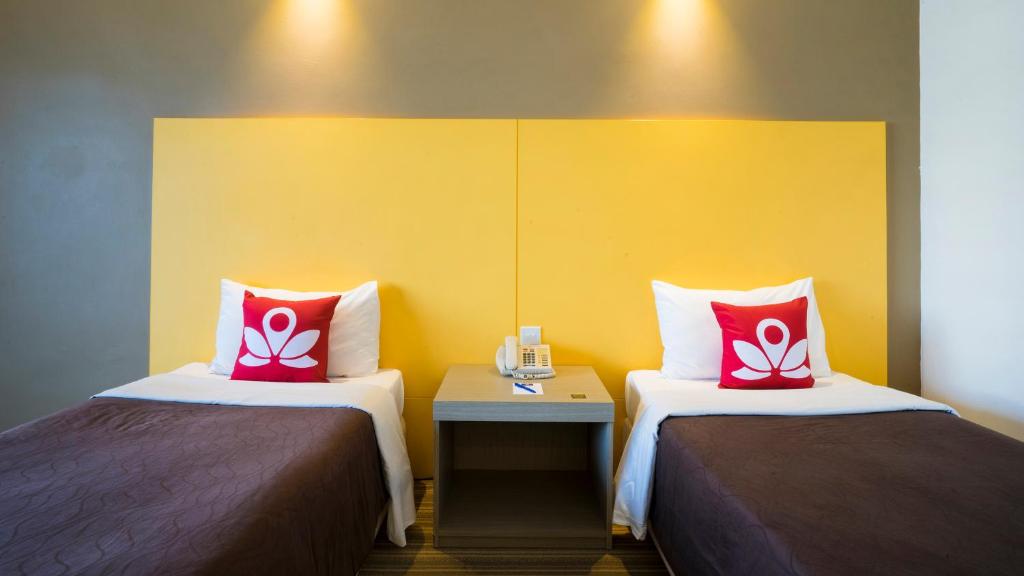 Двухместный (Улучшенный двухместный номер с 2 отдельными кроватями) отеля ZEN Rooms Orchard, Сингапур (город)