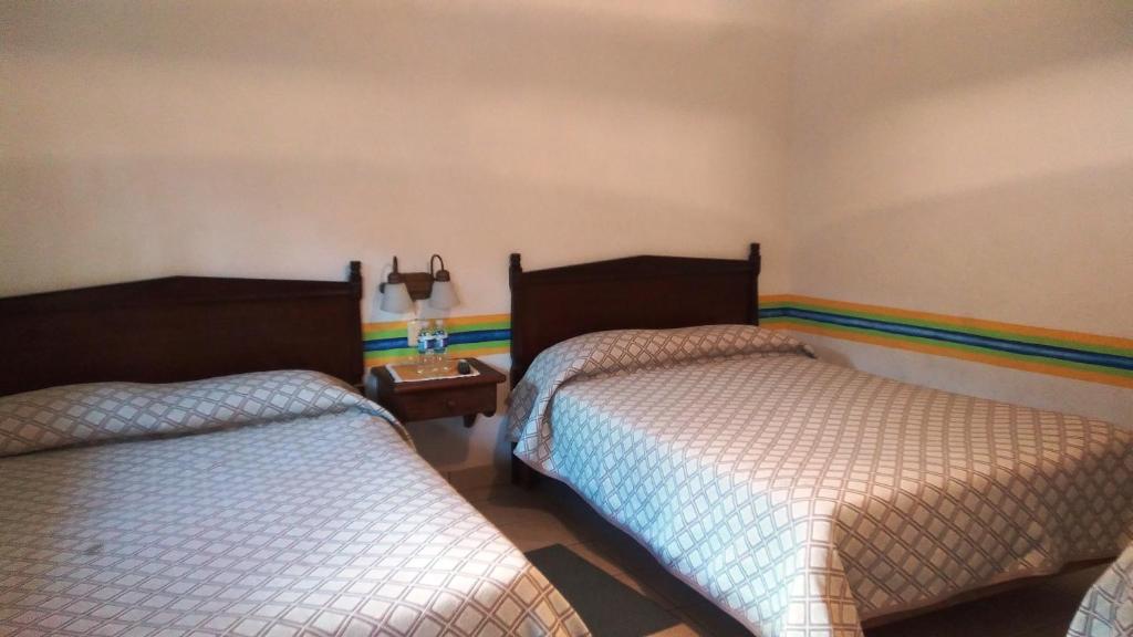 Двухместный (Двухместный номер с 2 отдельными кроватями) отеля Hotel Los Mezquites, Текискиаппан