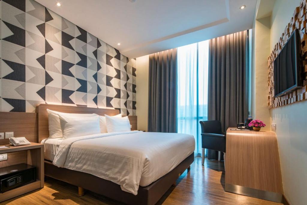 Двухместный (Двухместный номер Делюкс с 1 кроватью или 2 отдельными кроватями) отеля Luminor Hotel Pecenongan, Джакарта