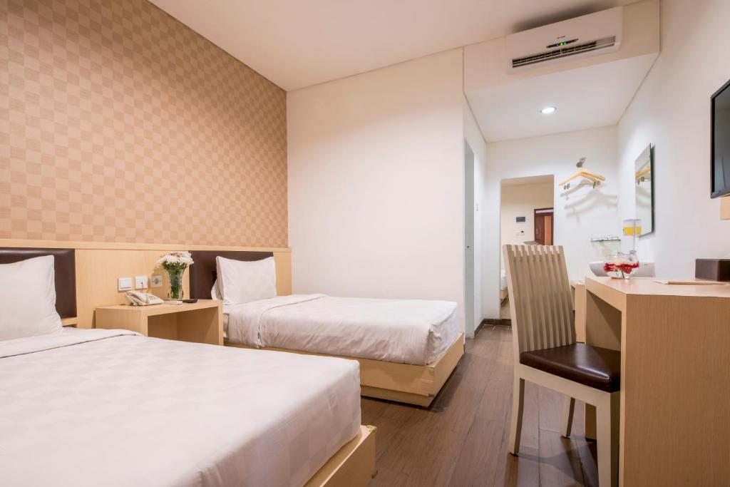 Двухместный (Двухместный номер Делюкс с 2 отдельными кроватями) отеля Hotel 88 Grogol, Джакарта