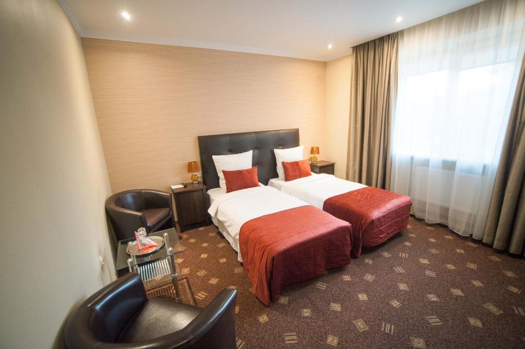 Двухместный (Стандартный двухместный номер с 2 отдельными кроватями) отеля Regina Hotel, Каунас