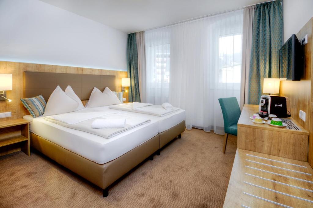 Двухместный (Двухместный номер с 1 кроватью или 2 отдельными кроватями) отеля Hotel Bergkristall, Флаттах