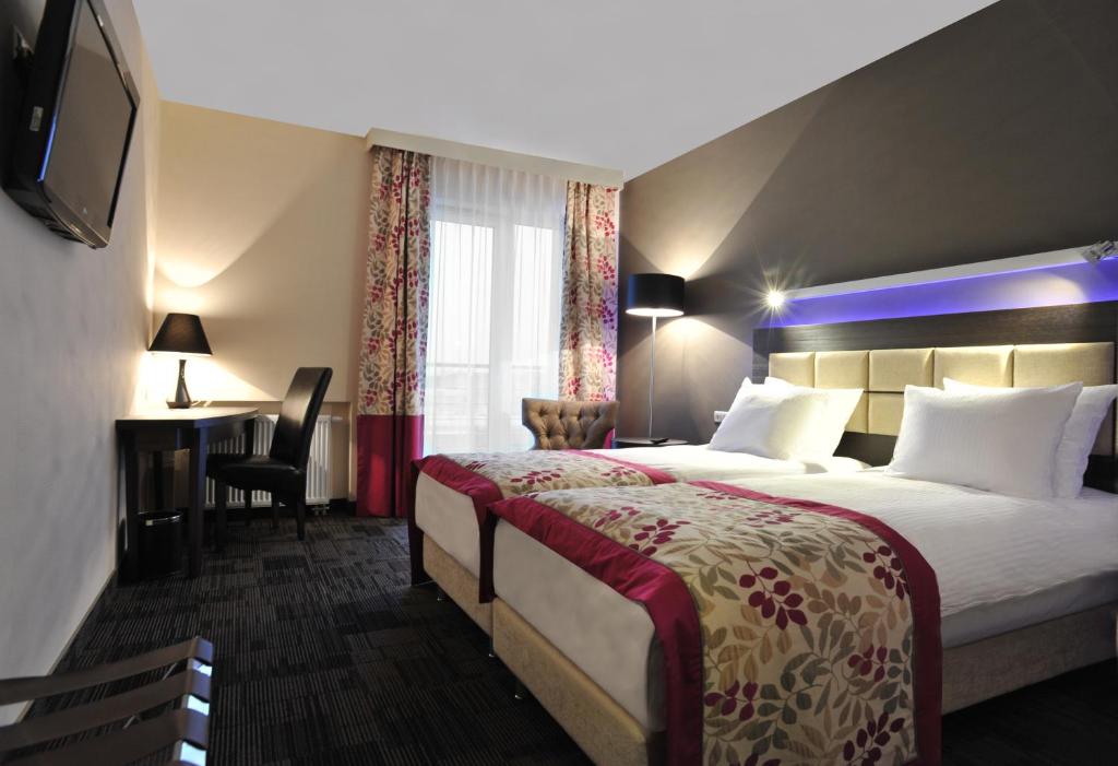 Двухместный (Улучшенный двухместный номер с 1 кроватью или 2 отдельными кроватями) отеля Hotel 3 Trio, Белосток