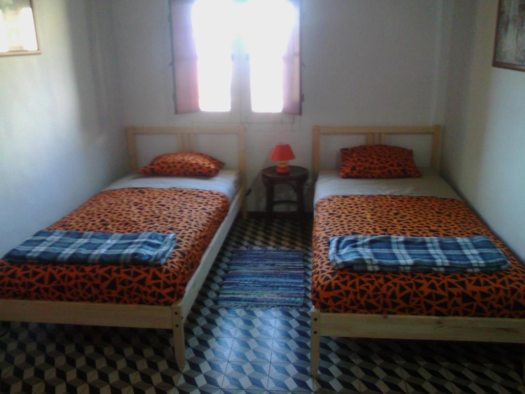 Двухместный (Улучшенный двухместный номер с 1 кроватью или 2 отдельными кроватями, вид на город) хостела Good Mood Hostel, Эвора