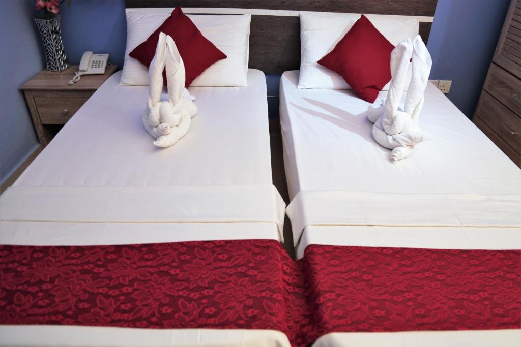 Двухместный (Улучшенный двухместный номер с 2 отдельными кроватями) гостевого дома Elite Beach Inn, Хулхумале