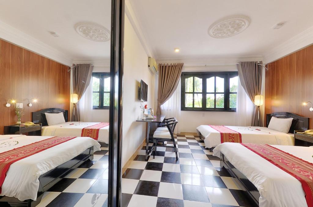 Двухместный (Улучшенный двухместный номер с 2 отдельными кроватями) отеля Hai Yen Hotel, Хойан