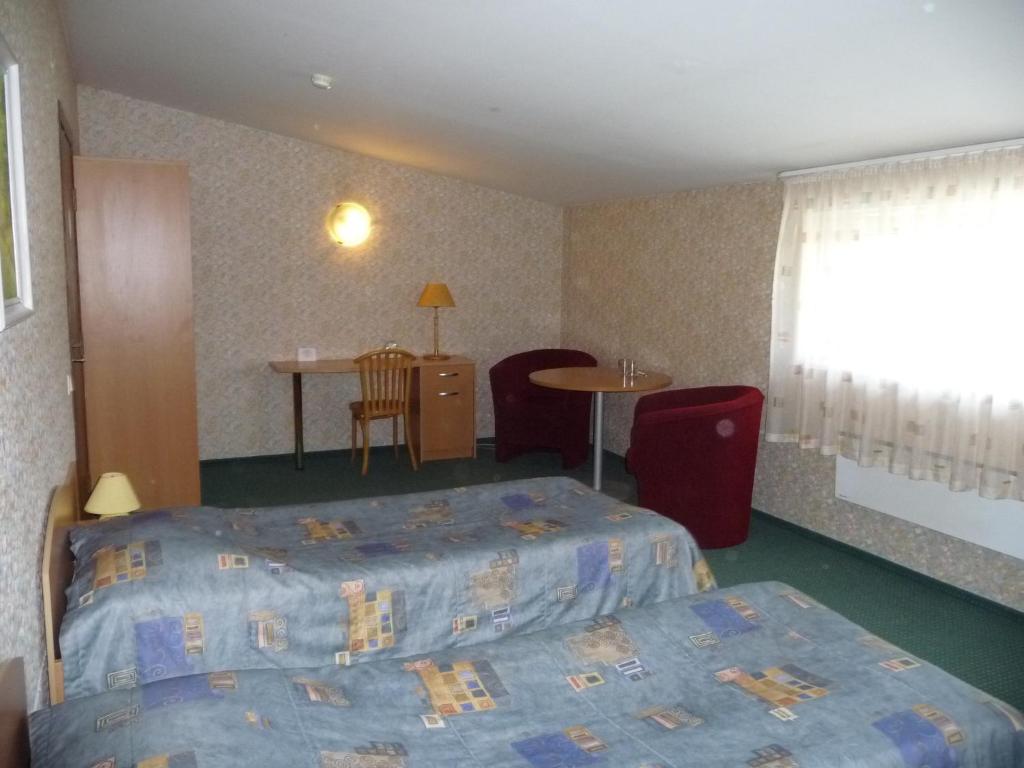 Двухместный (Стандартный двухместный номер с 2 отдельными кроватями) гостевого дома Motel Tėvynė, Каунас