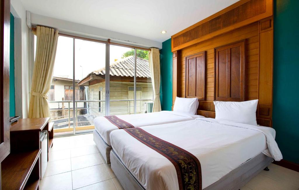 Двухместный (Стандартный двухместный номер с 2 отдельными кроватями) отеля Lamphu Tree House Boutique Hotel, Бангкок
