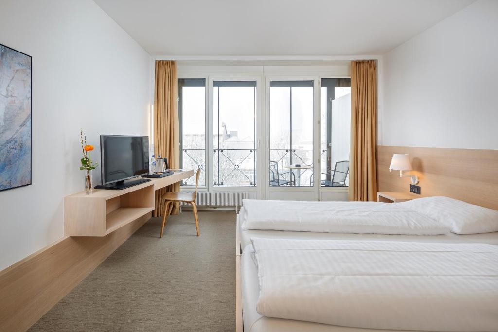 Двухместный (Стандартный двухместный номер с 2 отдельными кроватями) отеля Newstar Swiss Quality Hotel, Санкт-Галлен