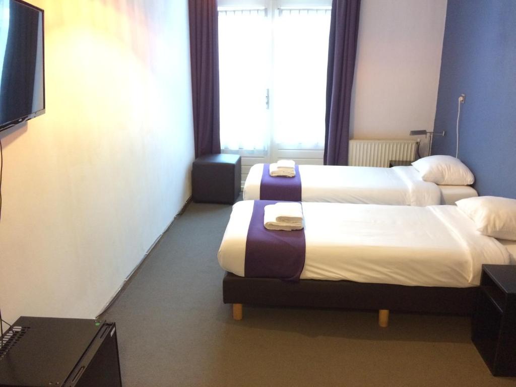 Двухместный (Бюджетный двухместный номер с 2 отдельными кроватями) отеля Hotel Bellington, Амстердам