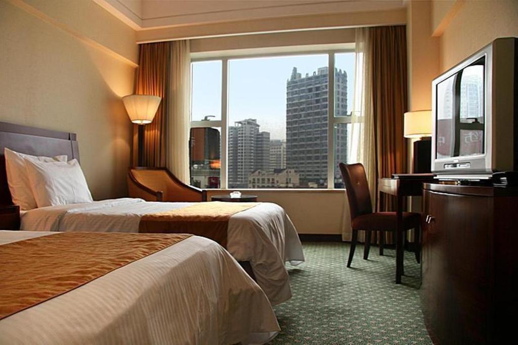 Двухместный (Стандартный двухместный номер с 2 отдельными кроватями) отеля Ningbo Portman Plaza Hotel, Нинбо