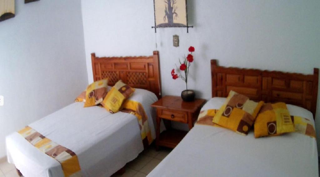 Двухместный (Двухместный номер с 2 двуспальными кроватями) отеля Quinta Belu Oaxtepec, Оастепек