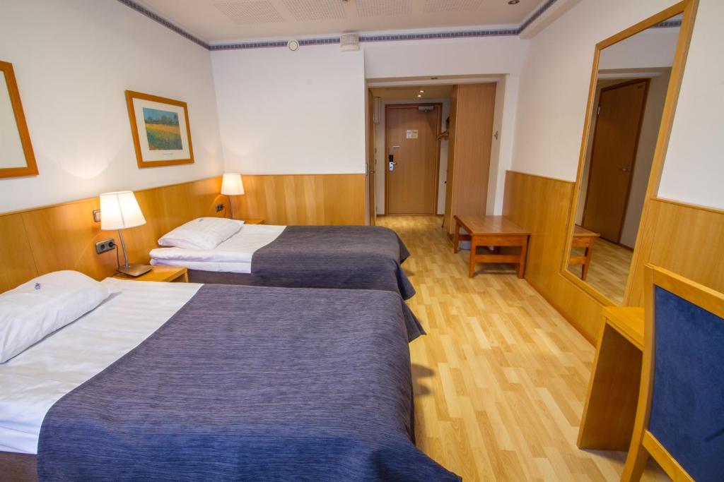 Двухместный (Стандартный двухместный номер с 2 отдельными кроватями) отеля Economy Hotel Savonia, Куопио