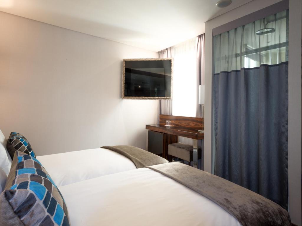Двухместный (Улучшенный двухместный номер с 2 отдельными кроватями) отеля TURIM Terreiro do Paço Hotel, Лиссабон
