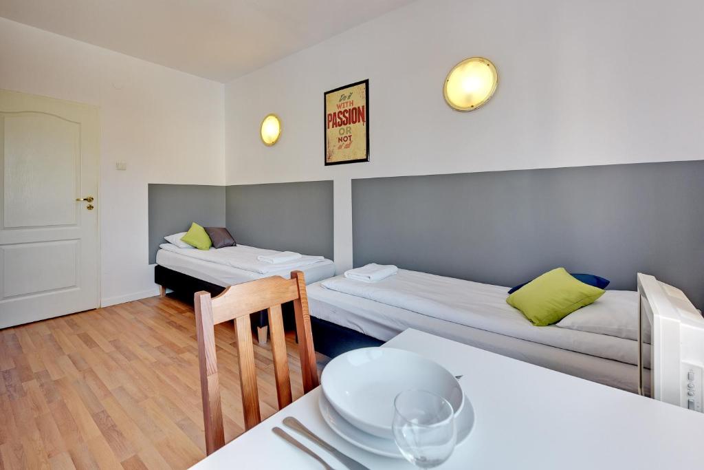 Двухместный (Двухместный номер с 2 отдельными кроватями и общей ванной комнатой) отеля Nice Rooms, Гданьск