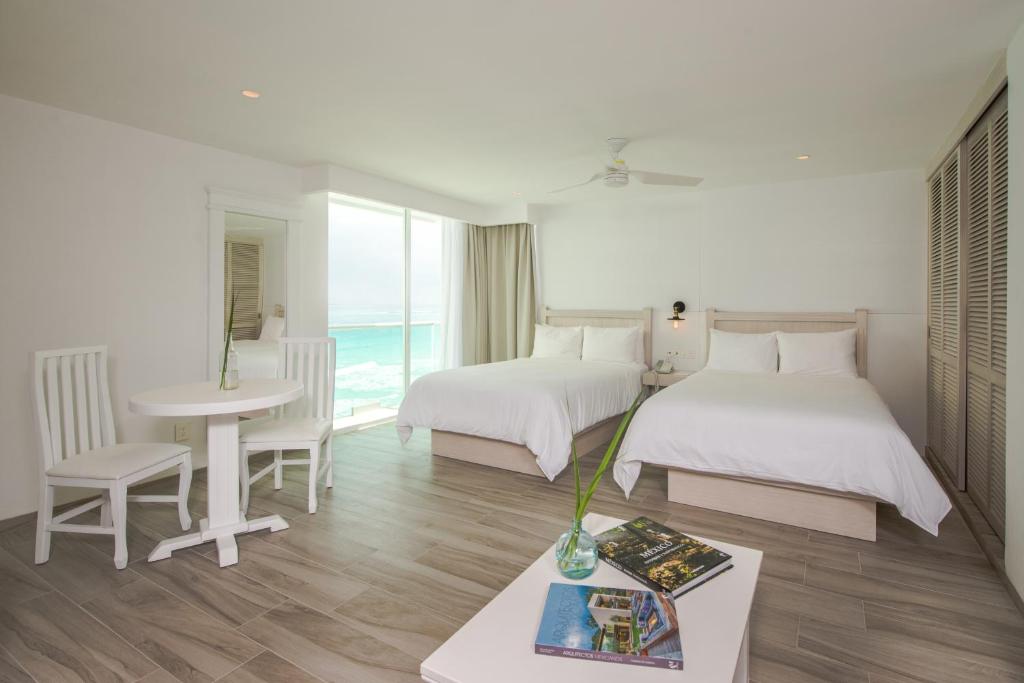 Двухместный (Улучшенный номер Inspira с видом на океан) курортного отеля Oleo Cancun Playa All Inclusive Boutique Resort, Канкун