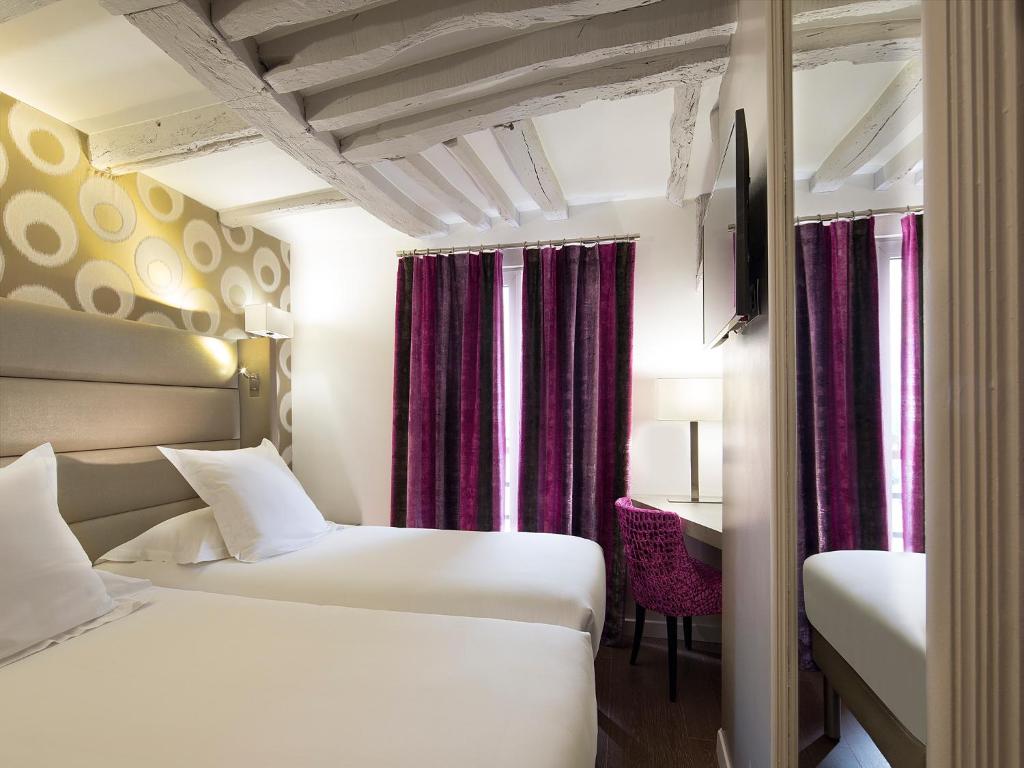 Двухместный (Улучшенный двухместный номер с 2 отдельными кроватями) отеля Hôtel Jacques De Molay, Париж