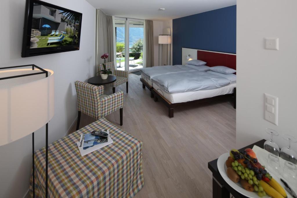 Двухместный (Дизайнерский двухместный номер с 1 одной кроватью или 2 отдельными кроватями) отеля Hotel Stella, Локарно
