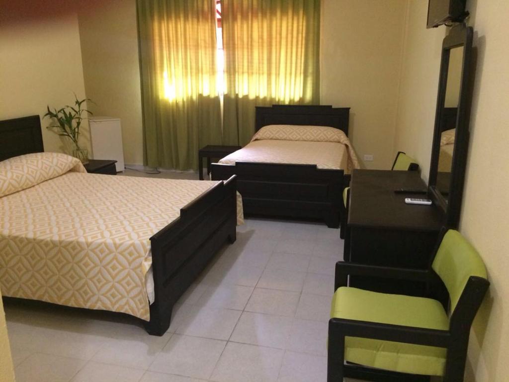 Сьюит (Стандартный двухместный люкс с 1 кроватью) отеля Hotel Santander SD, Санто-Доминго