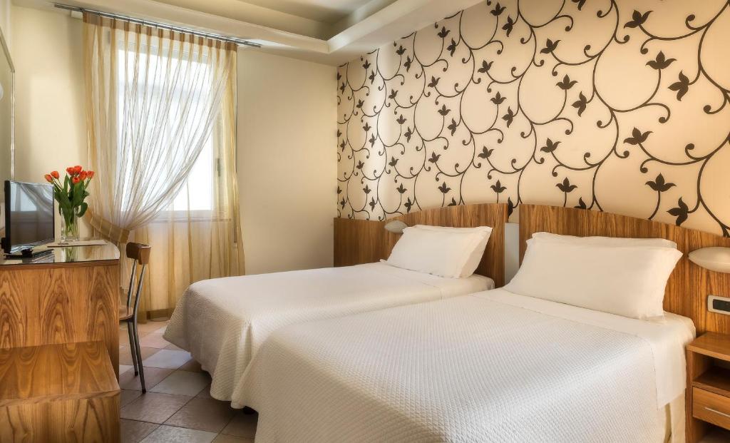 Двухместный (Двухместный номер с 2 отдельными кроватями) отеля ACasaMia WelcHome Hotel, Римини