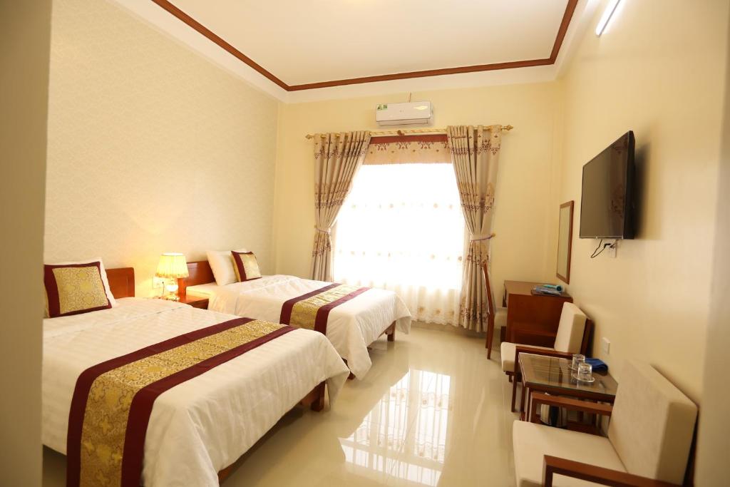Двухместный (Двухместный номер Делюкс с 2 отдельными кроватями) отеля Royal Hotel Ha Giang, Хазянг