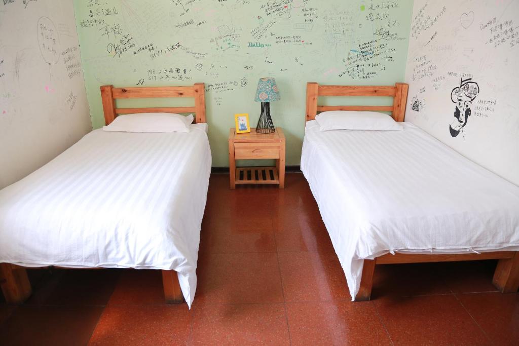 Двухместный (Стандартный двухместный номер с 2 отдельными кроватями) хостела Harbin North International Youth Hostel, Харбин