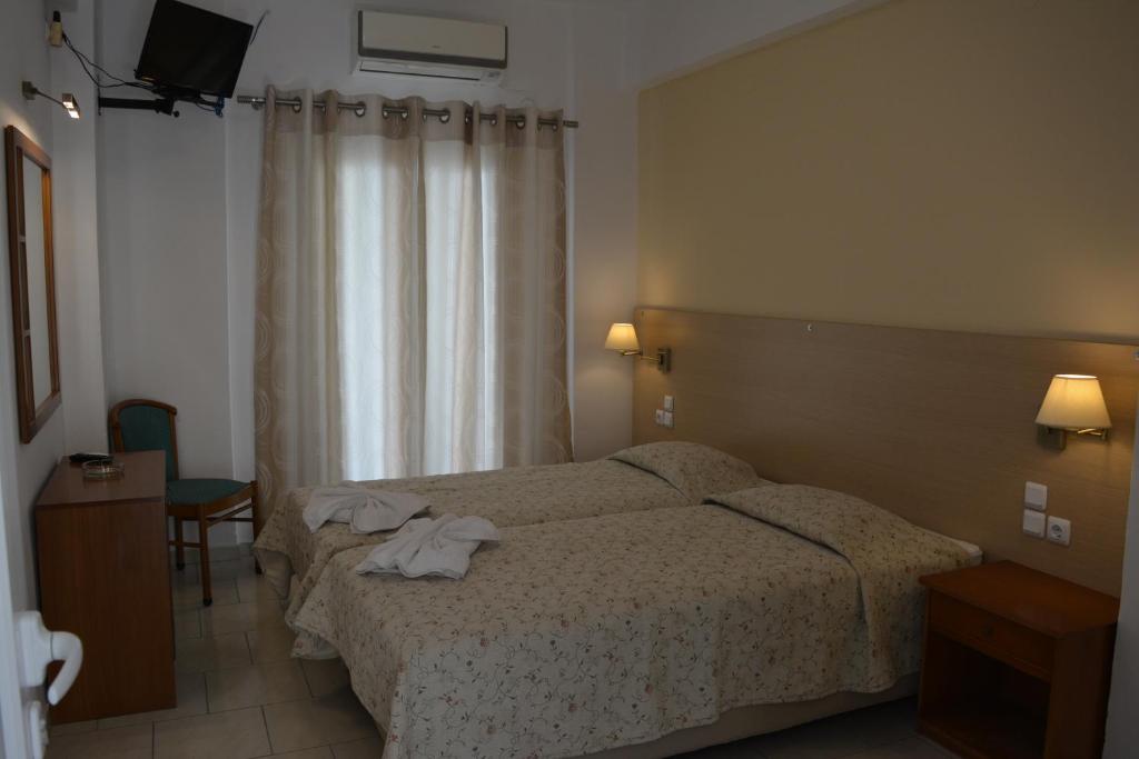 Двухместный (Стандартный двухместный номер с 2 отдельными кроватями) отеля Anemomilos Villa, Фиростефани