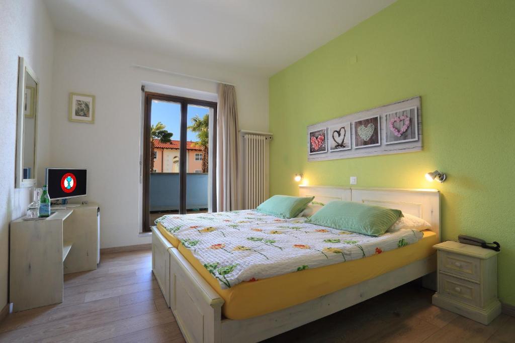 Двухместный (Стандартный двухместный номер с 2 отдельными кроватями и видом на сад) отеля Osteria Ticino, Аскона