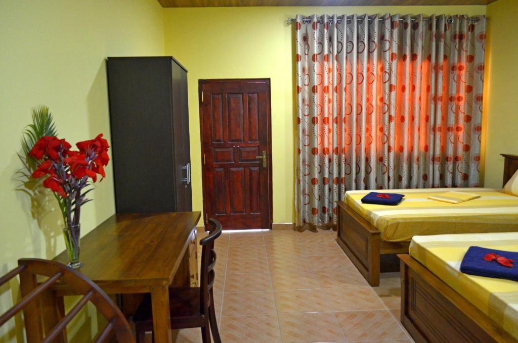 Двухместный (Двухместный номер Делюкс с 1 кроватью или 2 отдельными кроватями) отеля Green Land Villa, Ахангама