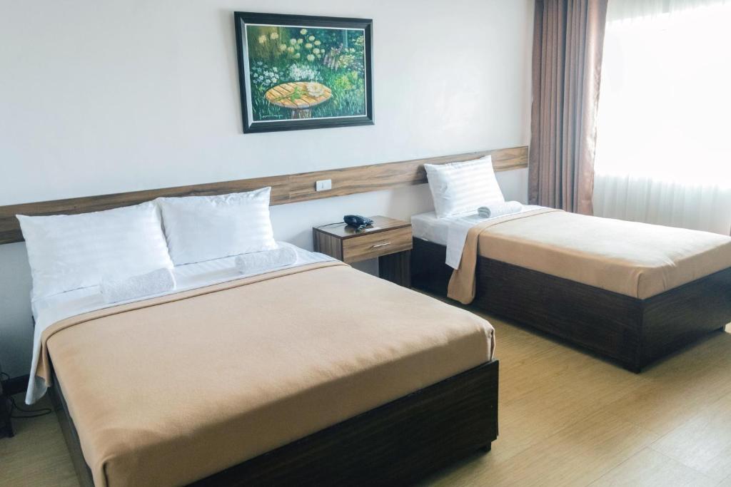 Трехместный (Улучшенный трехместный номер) отеля Leope Hotel, Себу