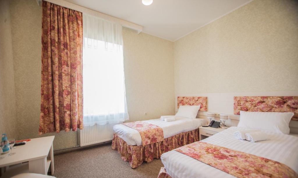 Двухместный (Просторный двухместный номер с 1 кроватью или 2 отдельными кроватями и с доступом в оздоровительный центр по утрам) отеля SanMari, Даугавпилс